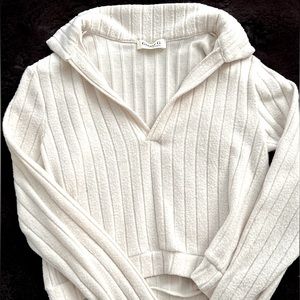 Cropped sweater with collar. Super cute with leggings or jeans.